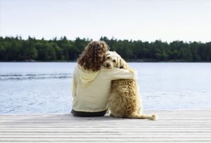 photolibrary_rf_photo_of_woman_with_dog_on_jetty