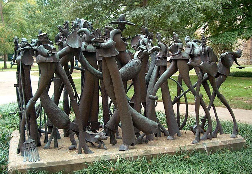 Copper sculpture of interacting people