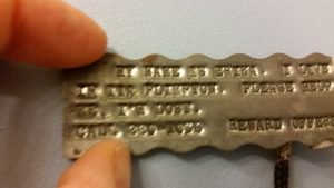 Home-made dogtag with author's college dorm address