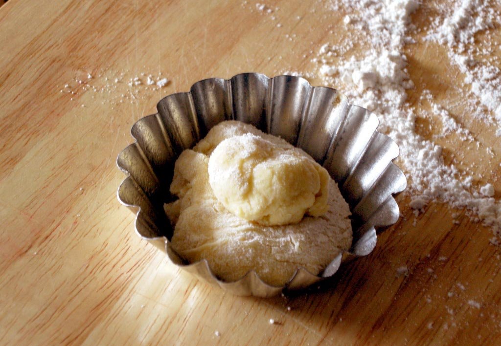 dough in small tart pan