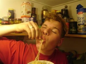 Man slurping noodles