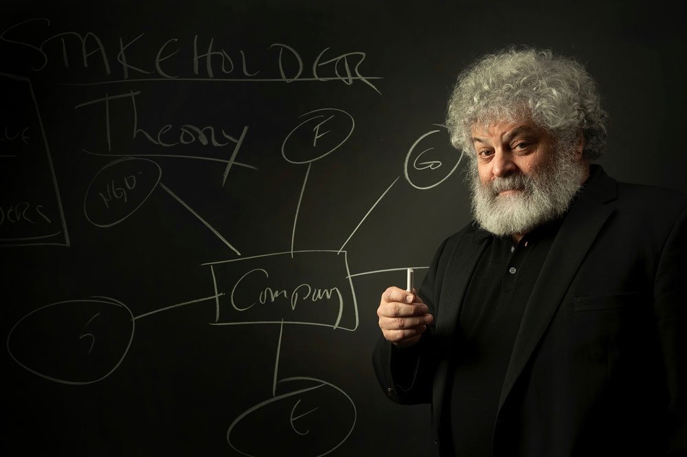 Professor Ed Freeman in front of blackboard