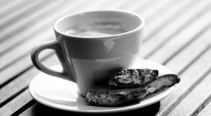 cup of espresso with biscotti