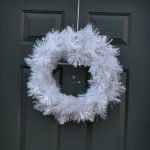 white holiday wreath on door
