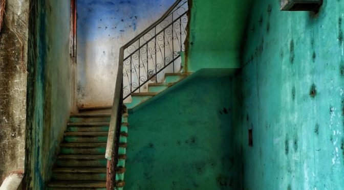 Stairway in a teal hallway