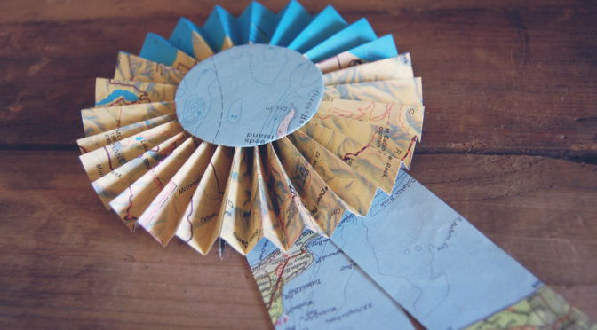 Color photo of a prize ribbon made from a map