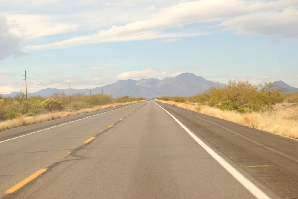 Photo of empty road, going toward mountains