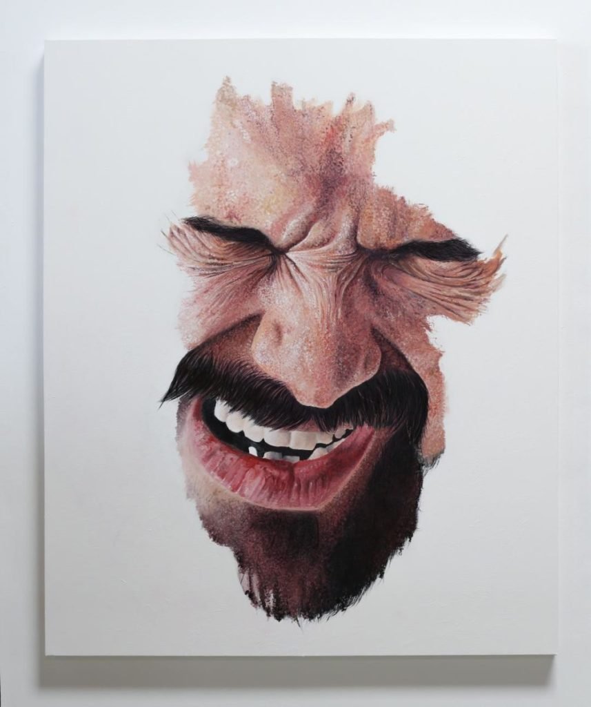 Partial painting of man's face in pain