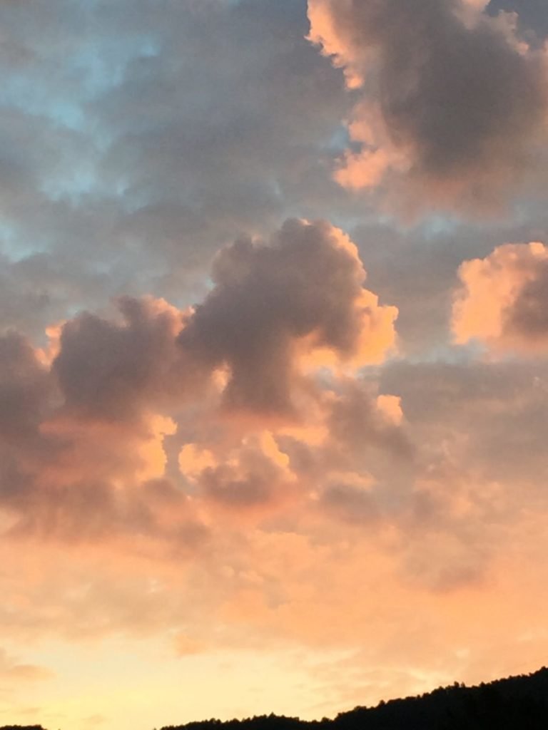 Photo of clouds in blue and orange sky