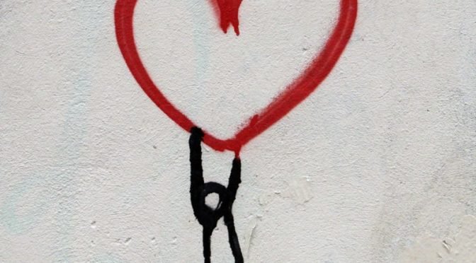 Painting of person hanging from heart