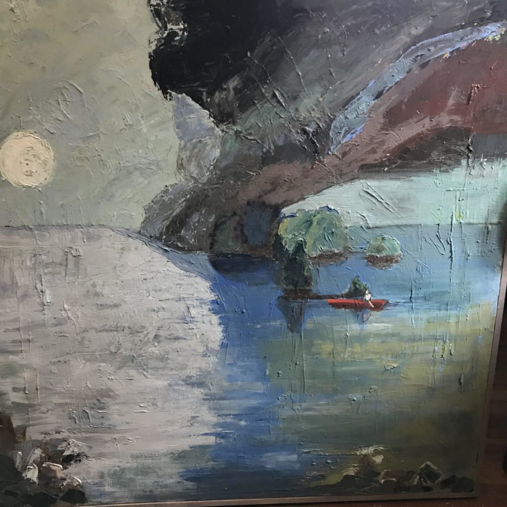 tiny red boat in blue water with dark cloud and full moon
