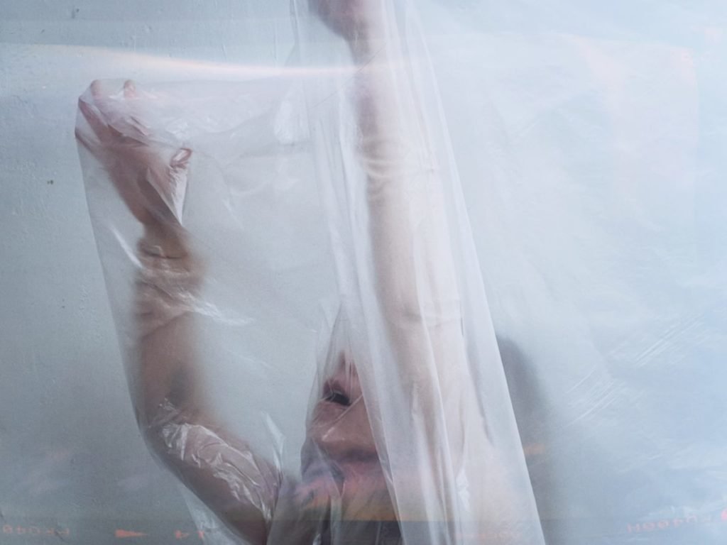 Photo of woman covered in plastic