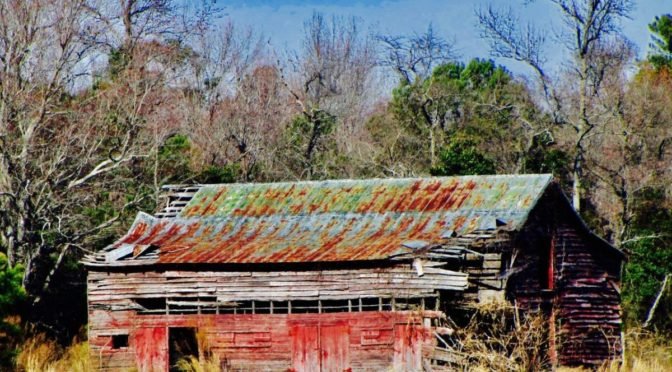 Photo of old barn with rusting roof