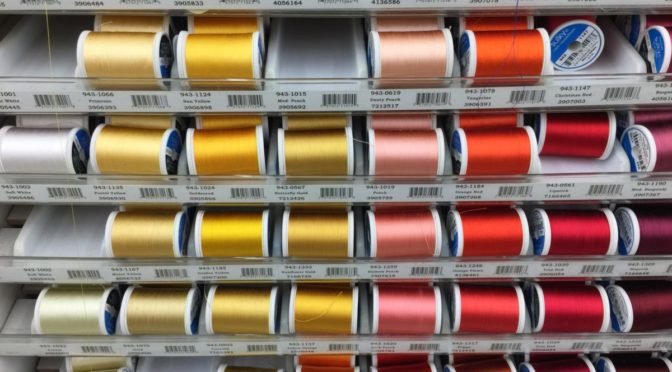 Photo of rows of colored thread