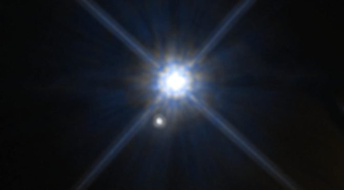 Light flaring against deep blue space