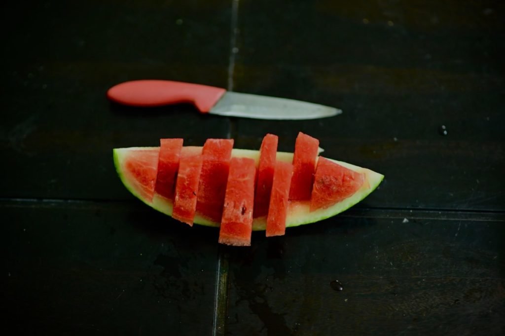Photo of watermelon slice and knife