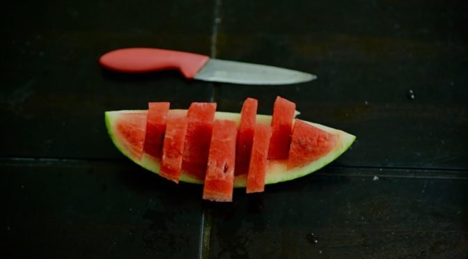 Photo of watermelon slice and knife