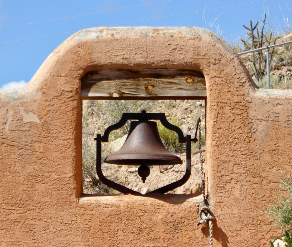Photo of bell in hole in wall