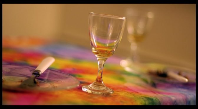 Photo of wine glass on colorful tablecloth