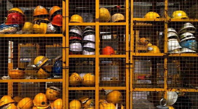 Photo of helmets behind wire cage