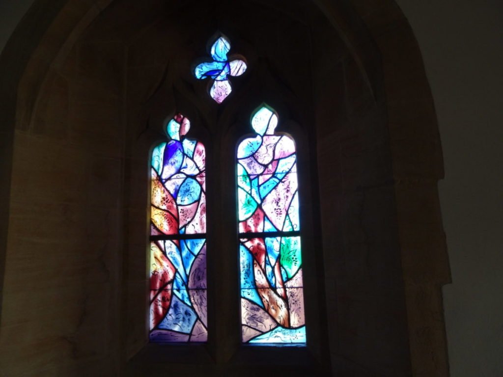 Two Stained Glass Windows paired together