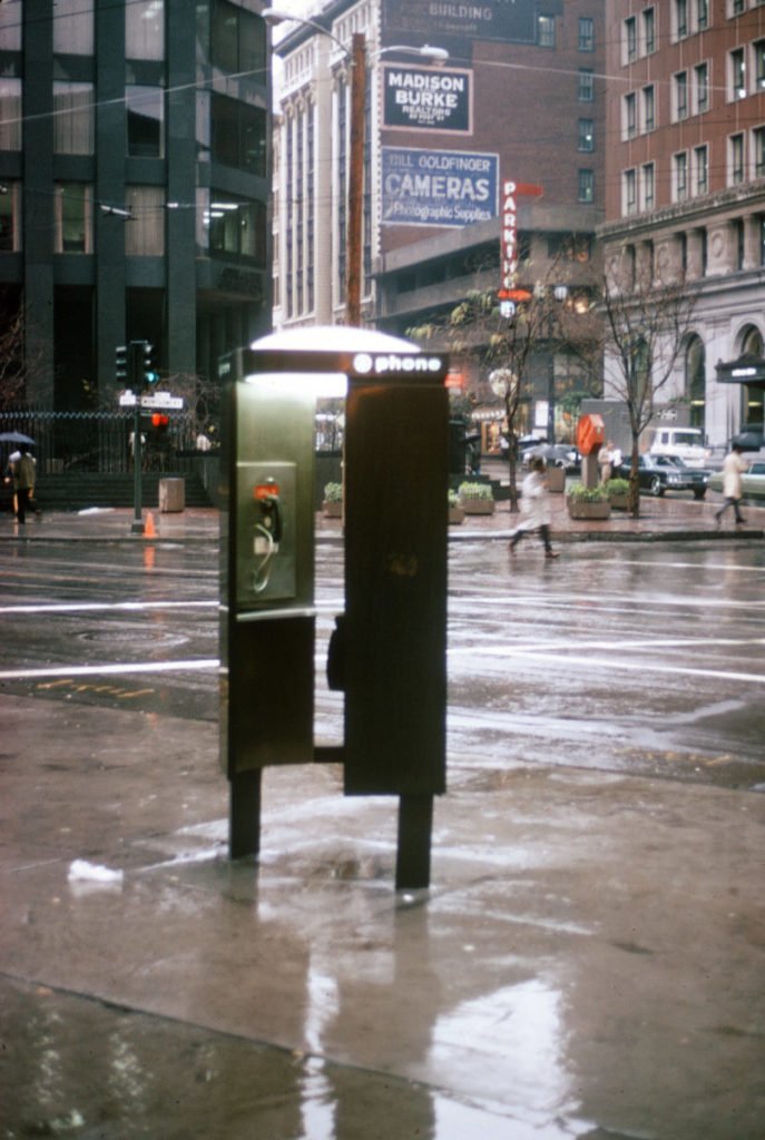 empty phone booth in rain