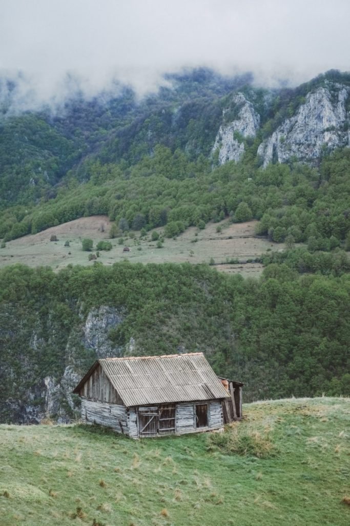 Photo of dwelling in front of mountains
