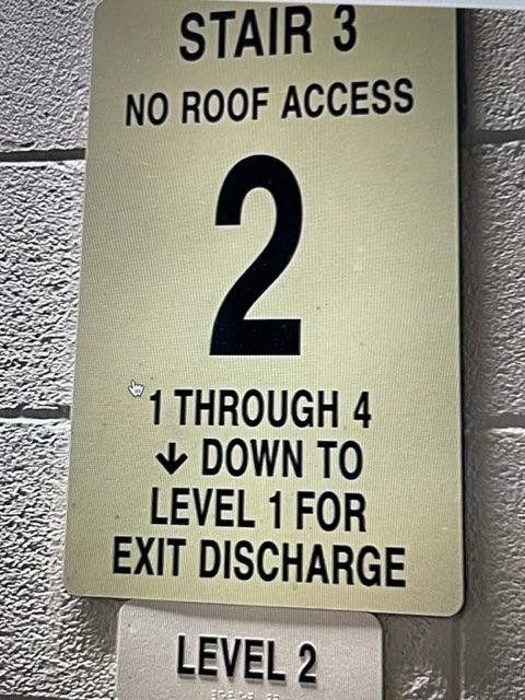 Photo of confusing stairwell sign