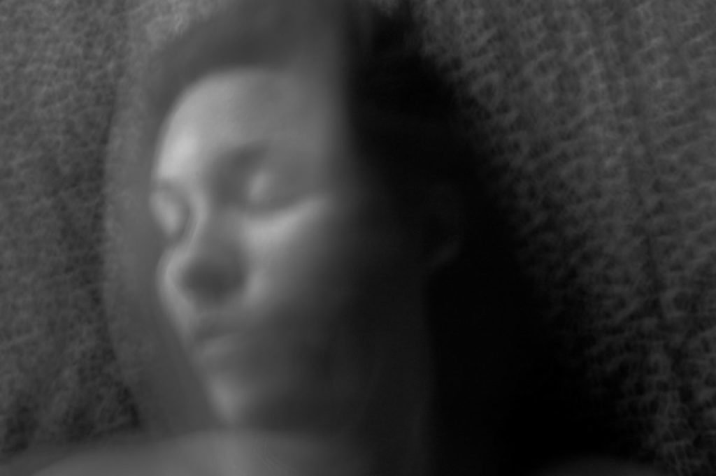 Black and white blurry photo of woman