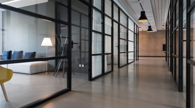 Photo of modern hallway with glass walls
