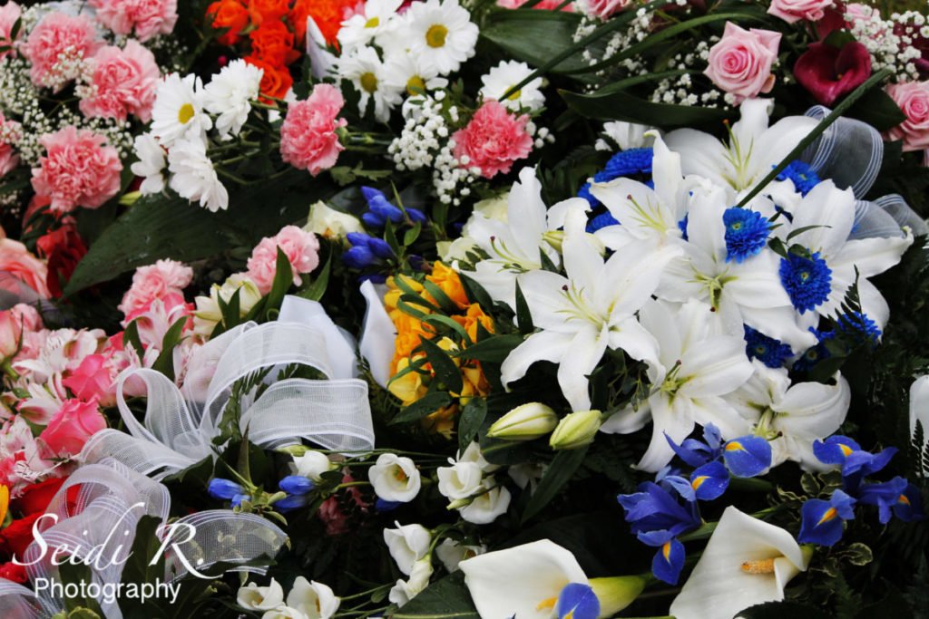 Photo of bouquets of funeral flowers