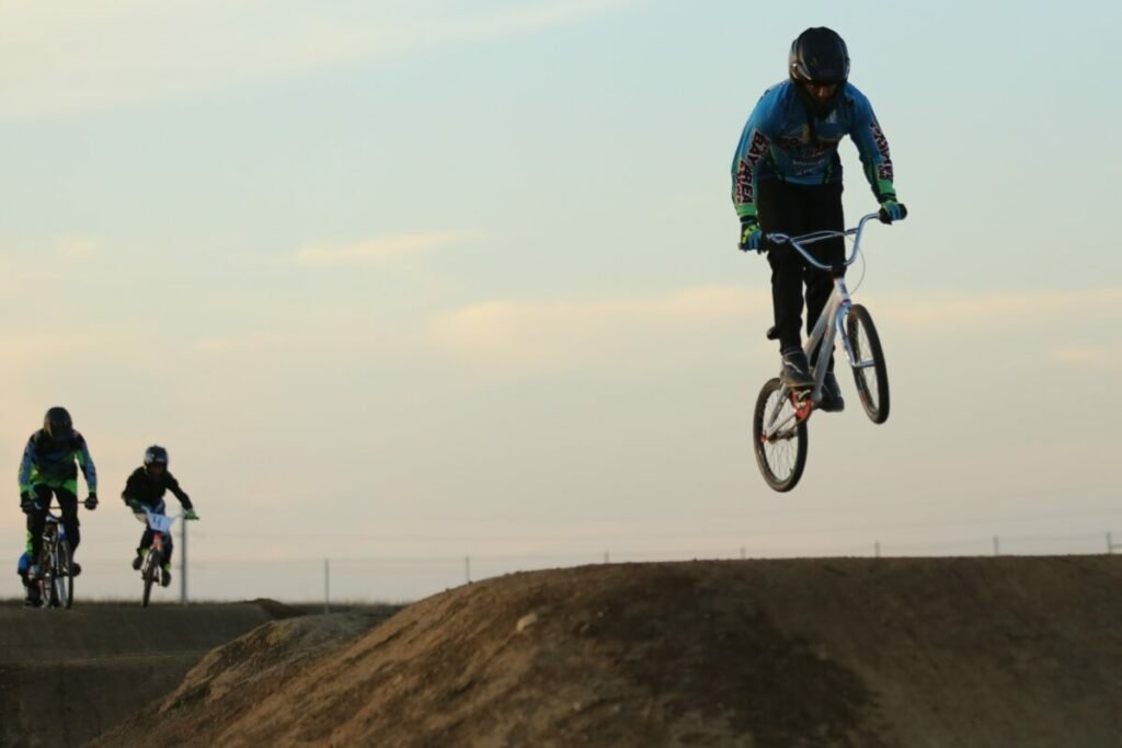 Photo of BMX riders on jumps