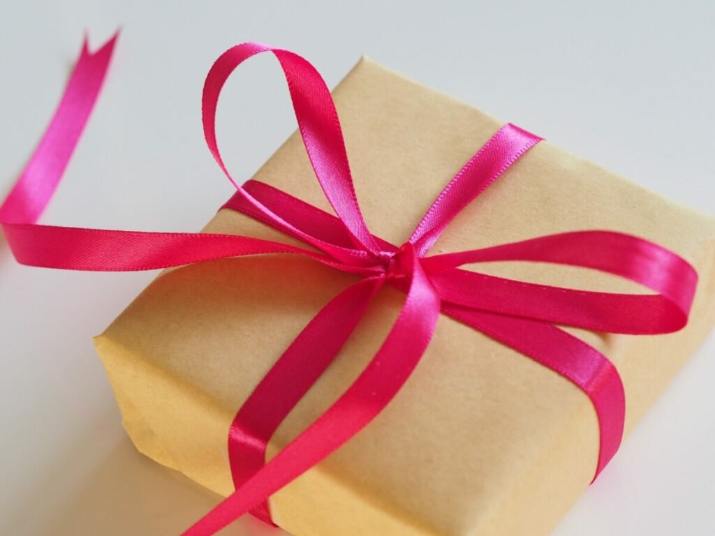 Photo of wrapped present with pink bow