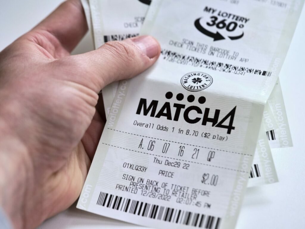 Photo of lottery ticket in hand