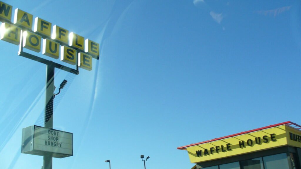Color photo of waffle house and its sign