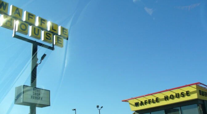 Color photo of waffle house and its sign