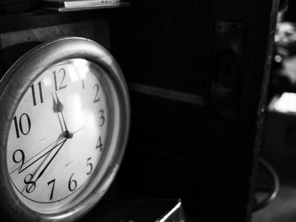 Black and white photo of analog clock