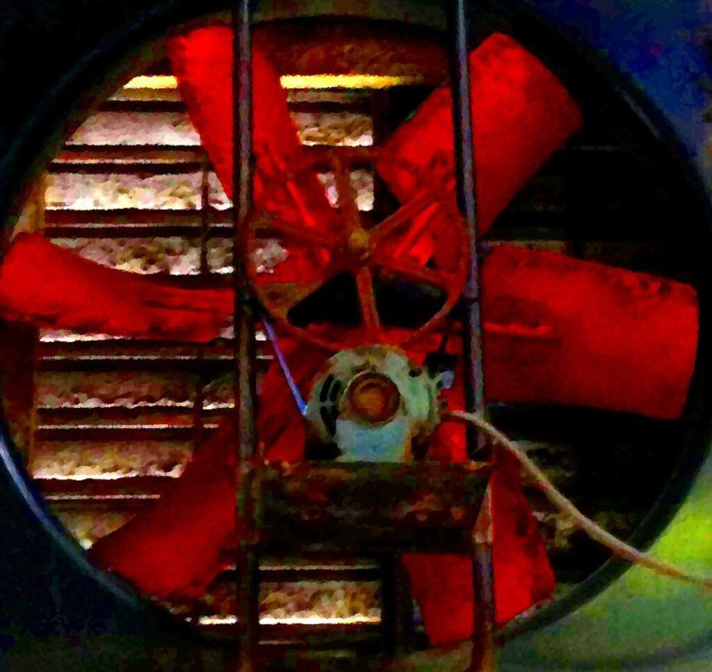Photo of backlit, red, industrial, fan