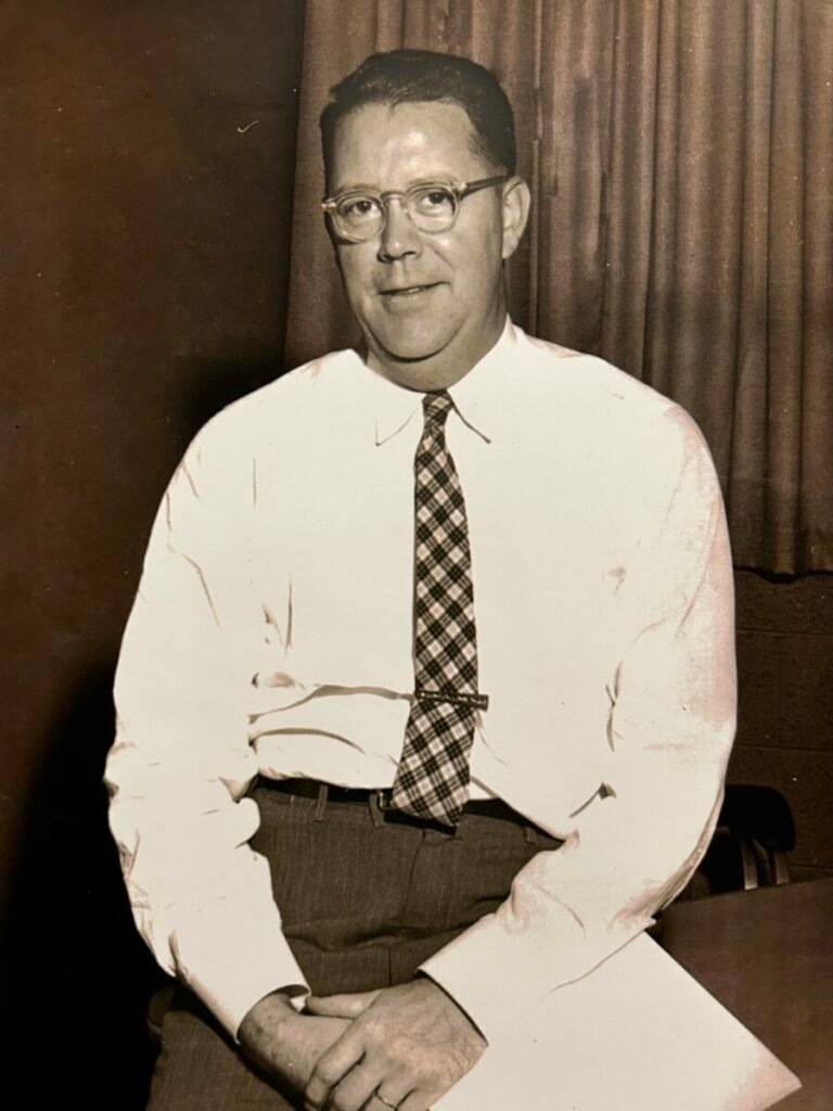 Black and white photo of man in glasses