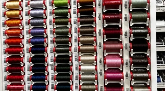 Photo of rows of different colors of thread