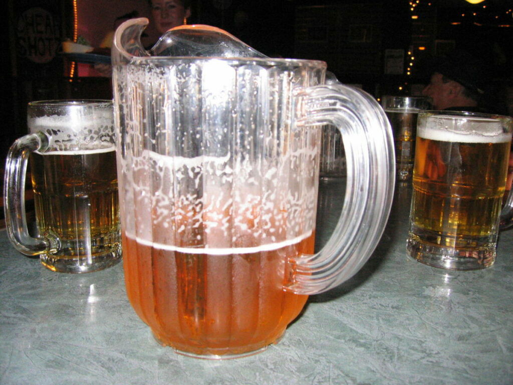 Photo of pitcher of beer and full glasses
