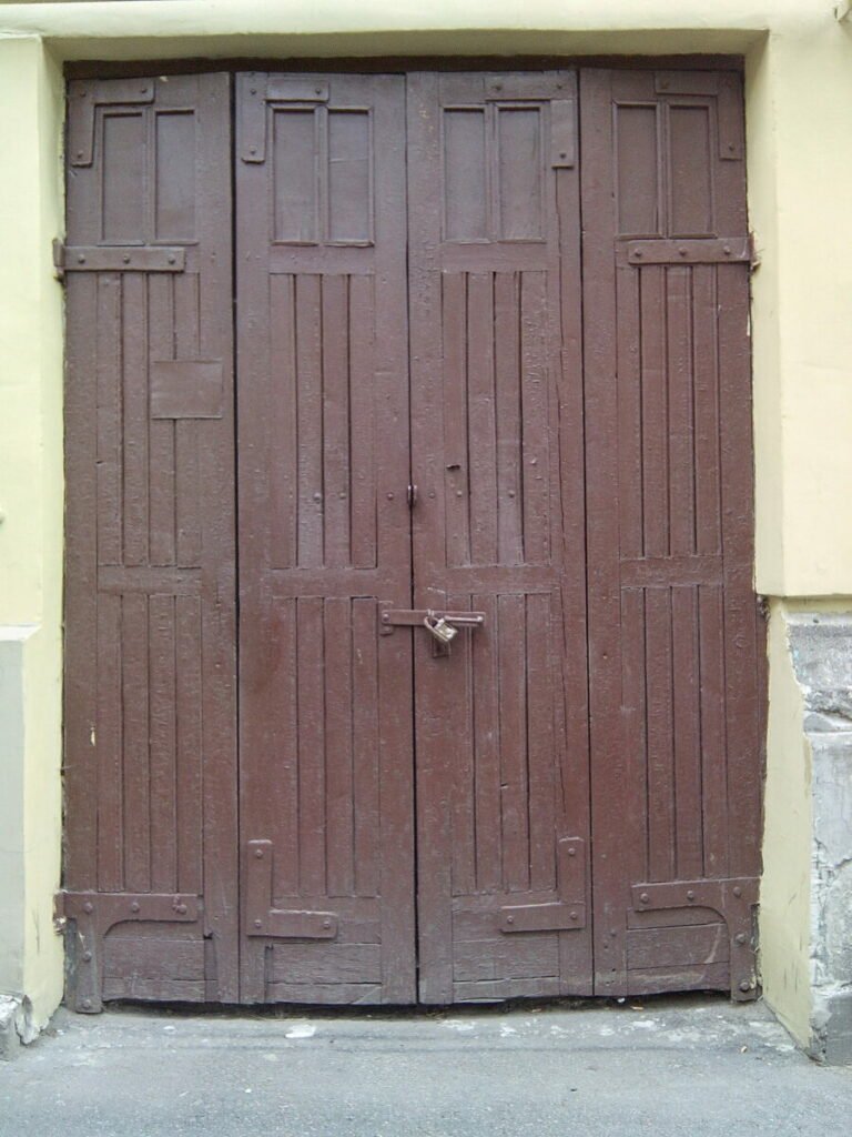 Photo of old brown door from exterior