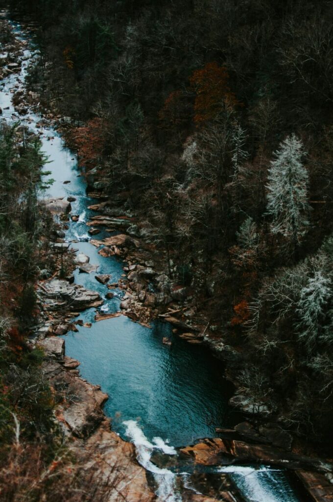 narrow blue stream between rocky banks