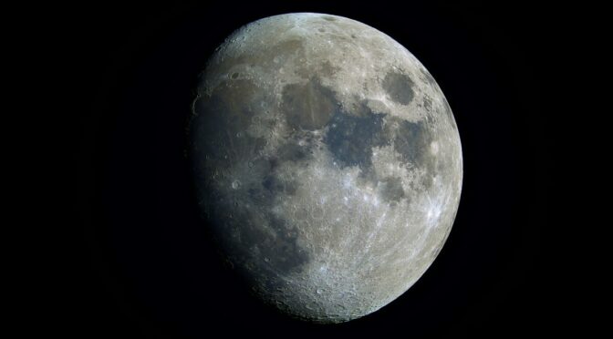 Gibbous moon in black sky