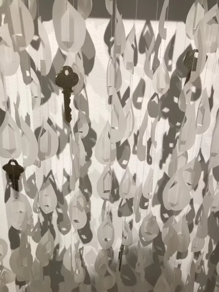 Mobile with lots of teardrop shapes and keys hanging