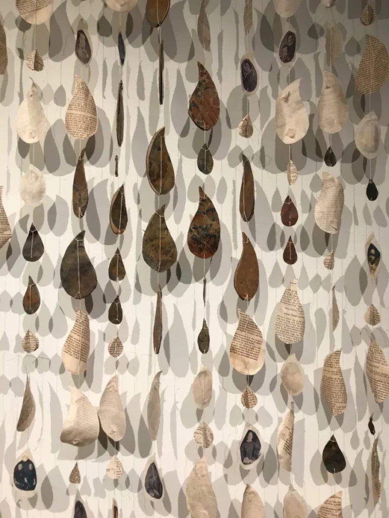 mobile with lots of raindrop shapes hanging