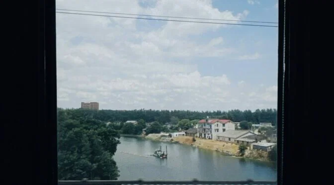 River and blue sky from window