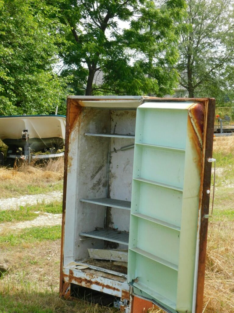 Photo of old refrigerator, door open