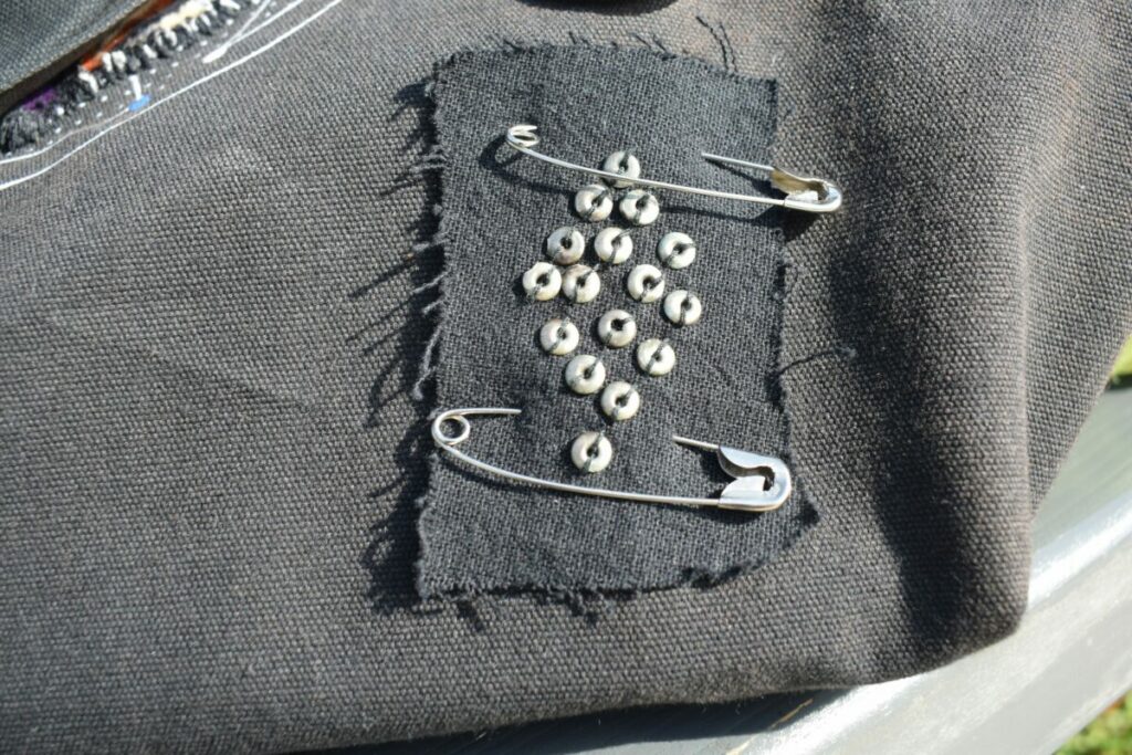 Photo of a patch held on with two safety pins