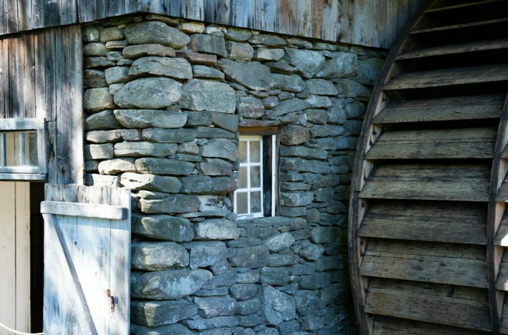 Photo of water mill wheel and building